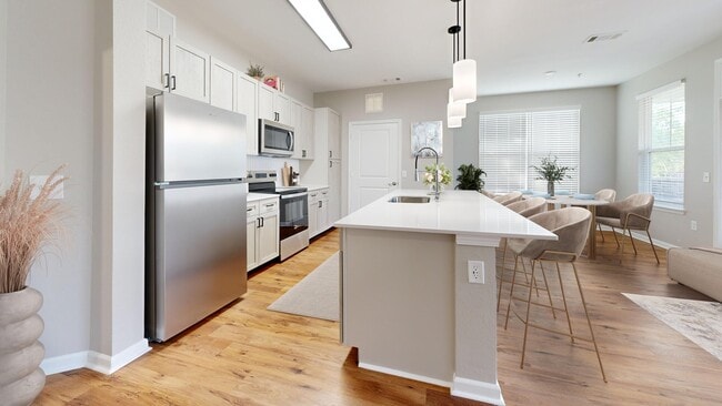Newly Renovated Kitchen with Quartz Counters - The Retreat at Hamburg Place Apartments