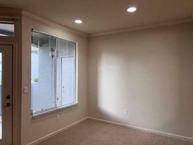 Photo - Gated condo with 1 car garage and community pool.