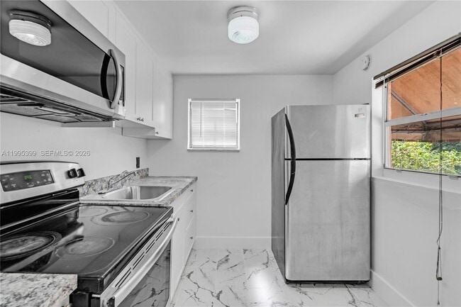 Building Photo - 56 NW 62nd St Unit 2