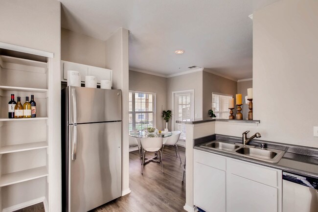Cook, dine, and gather in a stylish kitchen space. - Grove at Cherry Creek Park
