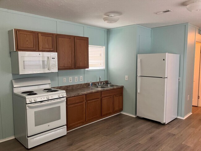 Photo - Single wide trailer on block foundation - ...