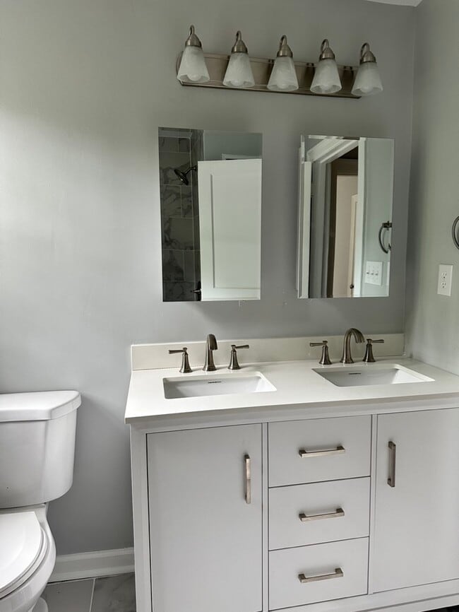 Great bathroom with plenty of storage options! - 1826 River Dr Unit Upstairs