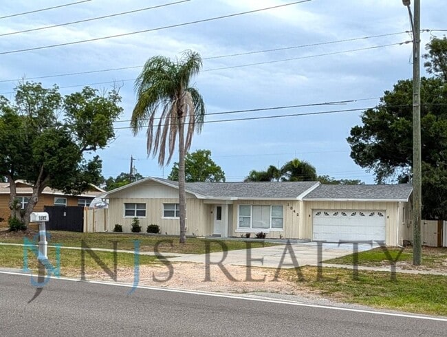 Building Photo - Beautiful 4/2/2 home with a POOL, 1700 Sq. Ft. with fenced yard, TONS of renovations