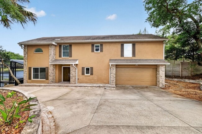 Building Photo - Available Now! Waterfront Living at Its Best – Pool, Decks & Gated Privacy