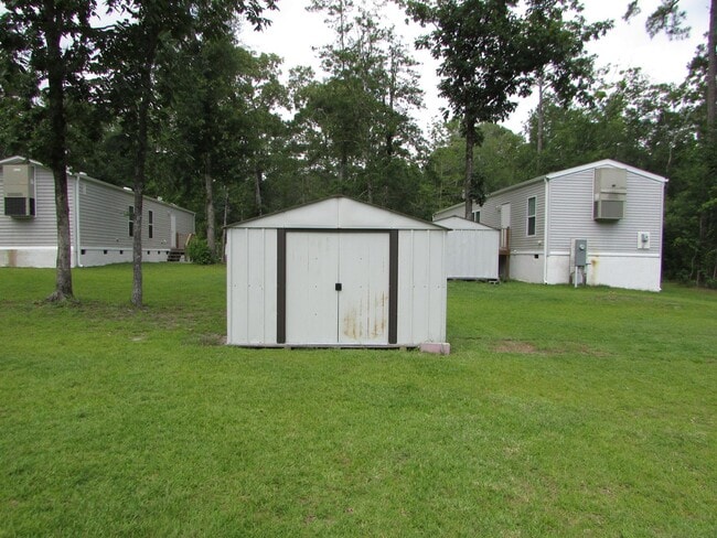 Photo - Single wide trailer on block foundation - ...