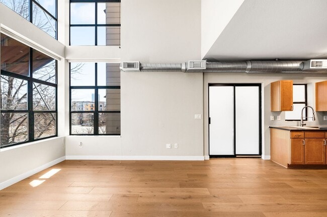 Photo - Modern 2BD, 1.5BA Condo with 20' Ceilings and Garage Parking Spot