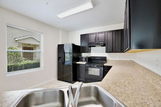 Photo - Spacious 3/2.5 Townhome with a 2 Car Garage and a Beautiful Pond View in Westwood Condos - Orlando!