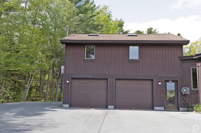 Upstairs apt over garage; front windows & 2 skylights; entrance door partially shows on right - 64 Gardner Rd Unit A Rental