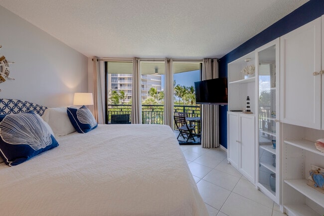 Primary Room with built in and TV - 2800 N Highway A1A Unit Beachfront Gem