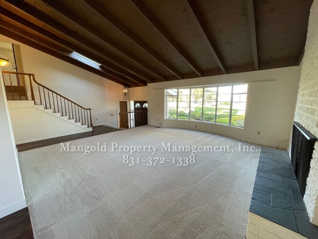 Photo - Beautiful 4-bed 2-bath Home with Cozy Fireplace, Front and Back Yards and Large Windows!