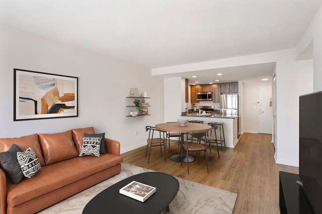 Renovated Package I kitchen, living, and dining area with hard surface flooring