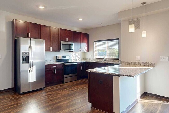 Whip up your favorites in a modern kitchen with ample counter space and stainless steel appliances. - 360 at Jordan West
