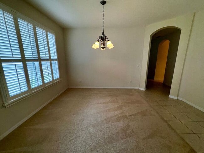 Photo - 4 Bedroom 3 bath Vista Lakes Home with a Fenced Backyard!