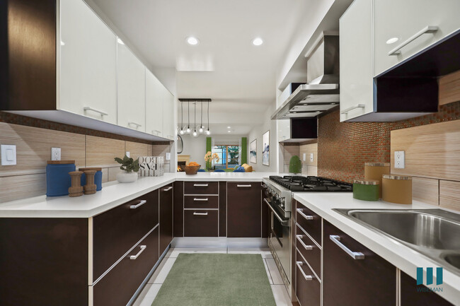 Large-Size Kitchen with Stainless-Steel Appliances and Ample Cabinet Storage - Sweetzer on Third by Wiseman Rental