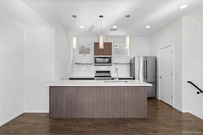 Kitchen with door to primary floor bathroom - 1238 Quitman St