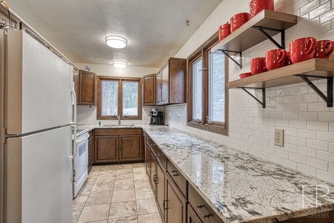 Photo - On the Blue River!  HUGE 4 Bedroom home, Furnished Updates throughout!  Bus route!  Spacious parking