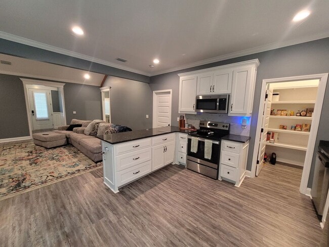 Photo - Elegant 4-Bedroom Home with Gourmet Kitchen, Luxurious Primary Suite & Fenced Yard in Hahira!