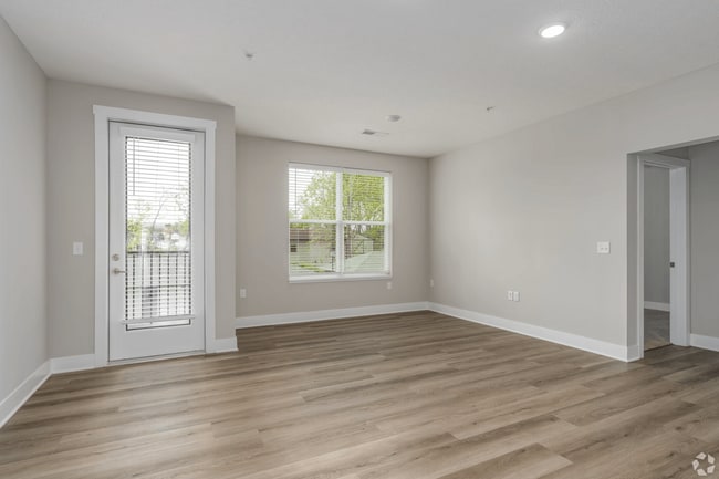 Living area with a patio/balcony of an apartment home at Tiffany Flats.