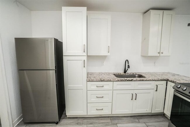 Photo - 1007 E 32nd Ave Unidad 1/2