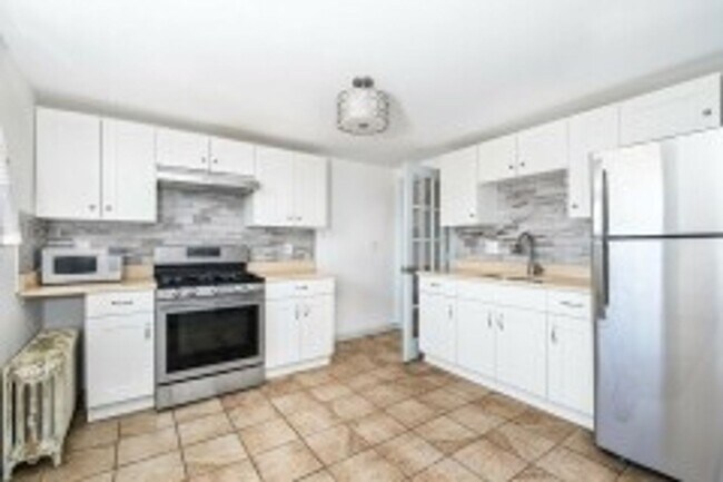Photo - Renovated 4BR with In-Unit Laundry Near Moody Street