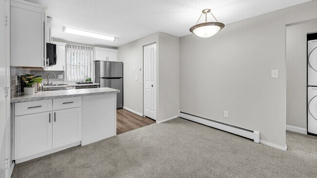 Savor meals in the separate dining area, uniting the living and kitchen spaces.