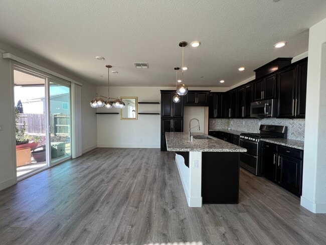 Photo - Beautiful 4 Bedroom Solar Home With Low Maintenance Landscaping And Updated Interior