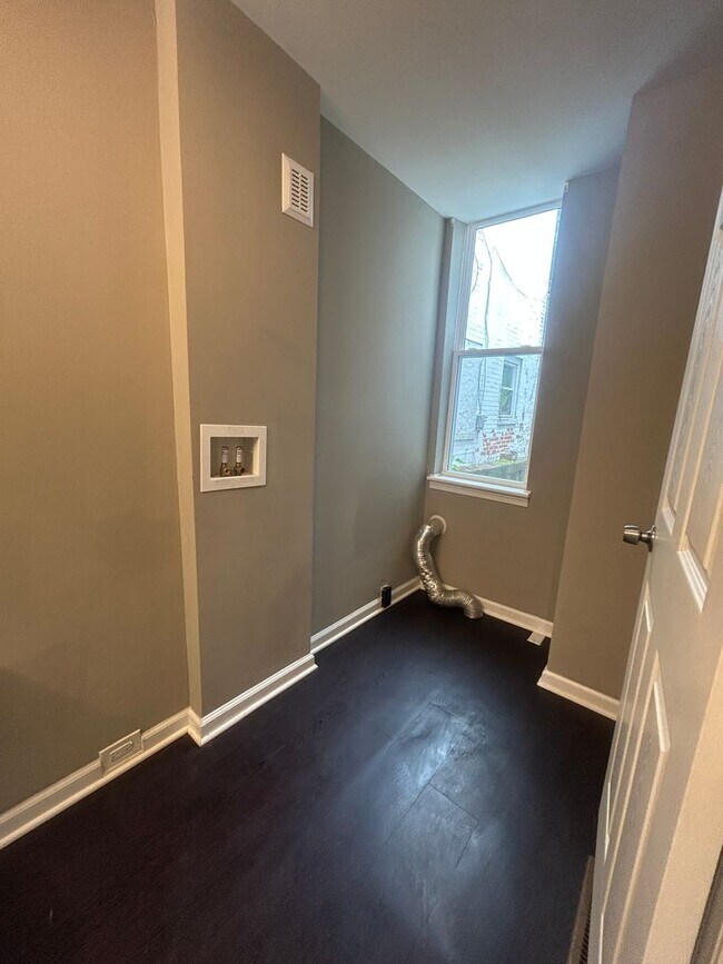 Photo - This end-of-row townhome Old Uptown Harris...