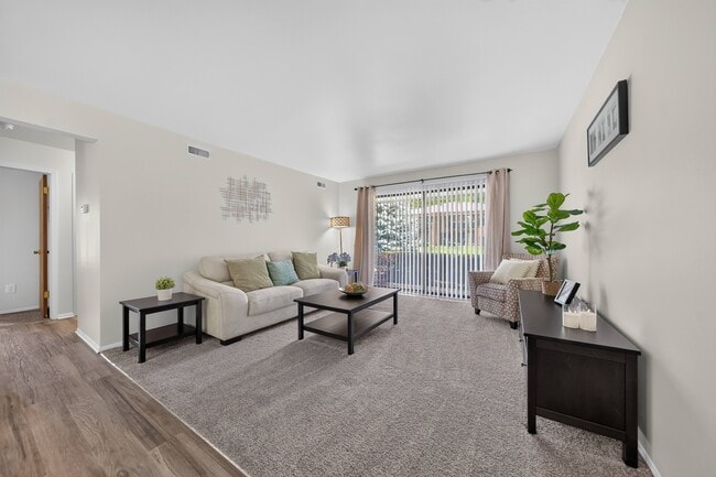 Open living room with natural light at Eastwood Village Apartments in Clinton Township, MI.