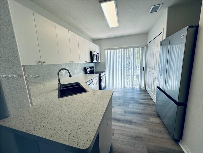 Building Photo - 5705 NW 109th Ave Unit 50