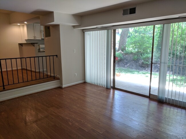 living room with with walk-out patio - 4705 Tecumseh St Unit 103