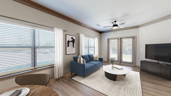 Newly Renovated Living Room with Gorgeous Hardwood-Style Flooring - Avenues at Craig Ranch Apartments