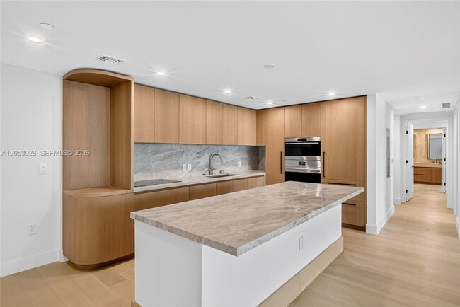 Building Photo - 1176 97th St Unit 501