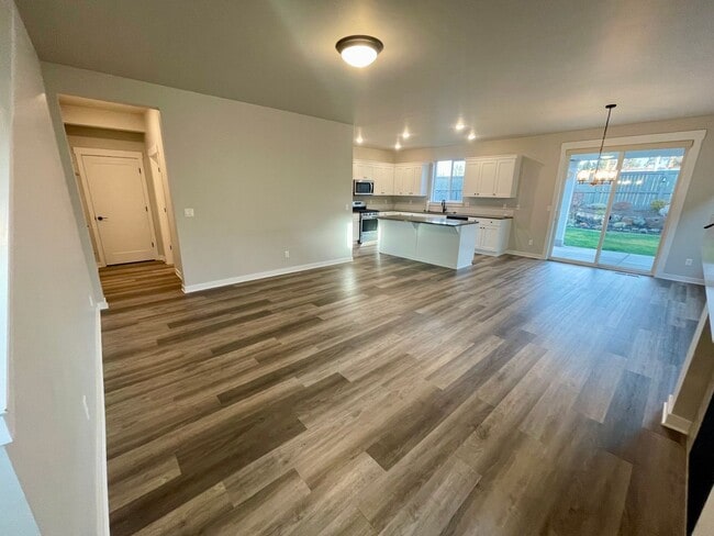 Photo - Spacious 3-bedroom and 2nd living room 2 1/2-full bath with New carpet, pad and LVT flooring