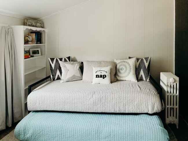 living room w daybed as a couch - 22101 Nowlin St Unit West Dearborn Apartment