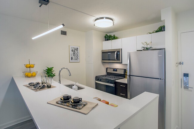 Open Kitchens feature Quartz Countertops and Breakfast Bar