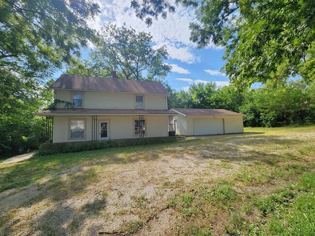 Photo - Nice home with oversized 2car gar with work bench and large shaded yard. Country-like setting