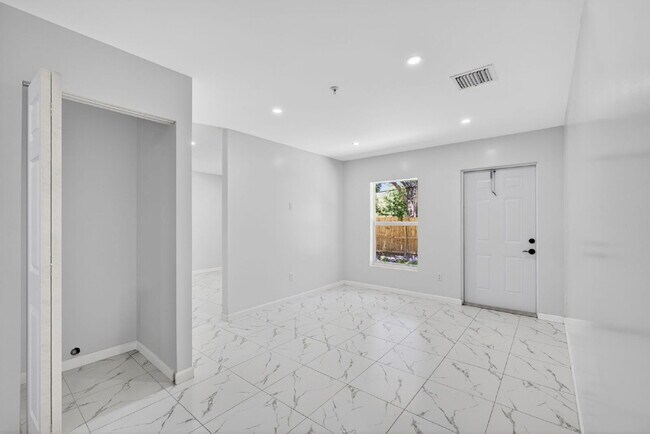 "Spacious 4-Bedroom Oasis with 2 Full Baths in Beautiful Riviera Beach!"