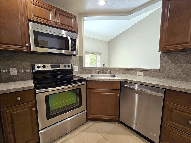 Building Photo - 3457 NW 44th St Unit 205