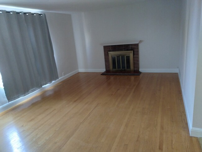 Living room with fireplace - 2729 Webster St Apartments Unit 2729