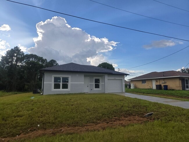 Building Photo - Brand New 2/2/1- SW Lehigh Acres Rental