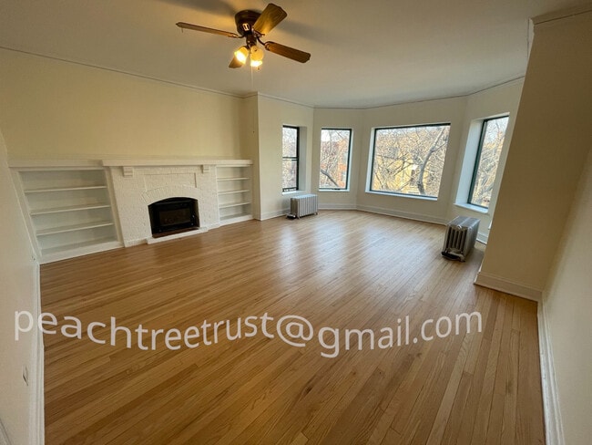 large and sunny front room in an oversize, top floor apartment. - 1351 W Carmen Ave Unit 1