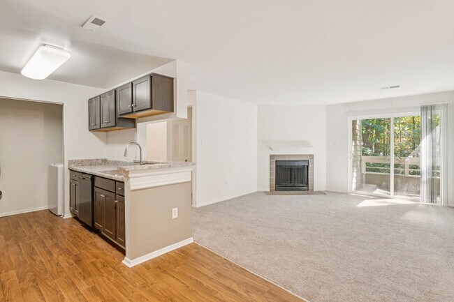 Kitchen Island to Living Room with Balcony and Fireplace - Sundance Station