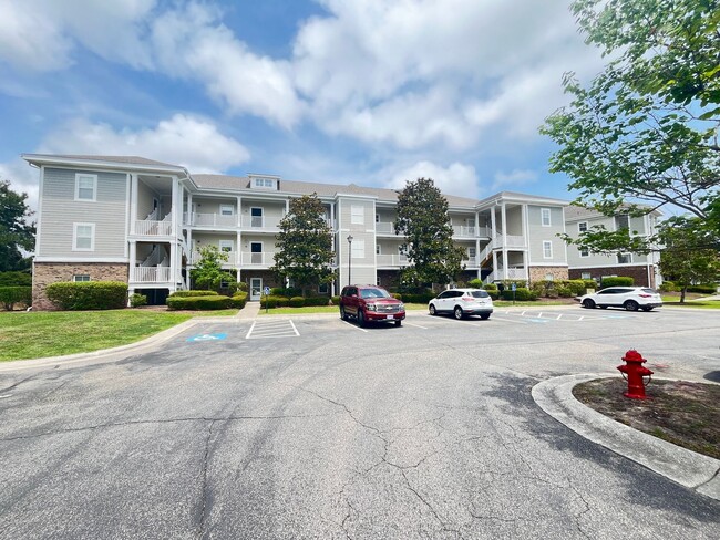 Photo - First Floor, 2 Bedroom, 2 Bath Condo with Screened Patio! Community Pool! Available Now!