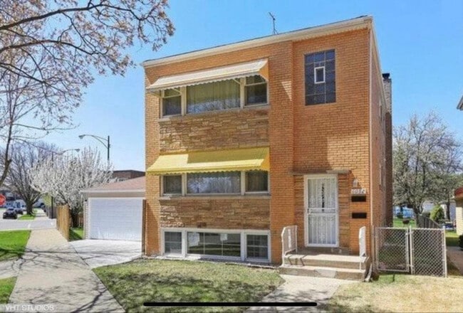 Building Photo - 6052 W Miami Ave Rental