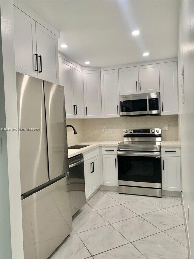 Building Photo - 4855 NW 7th St Unit 208-6