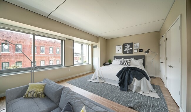 Spacious master bedroom features a walk-in closet and huge windows