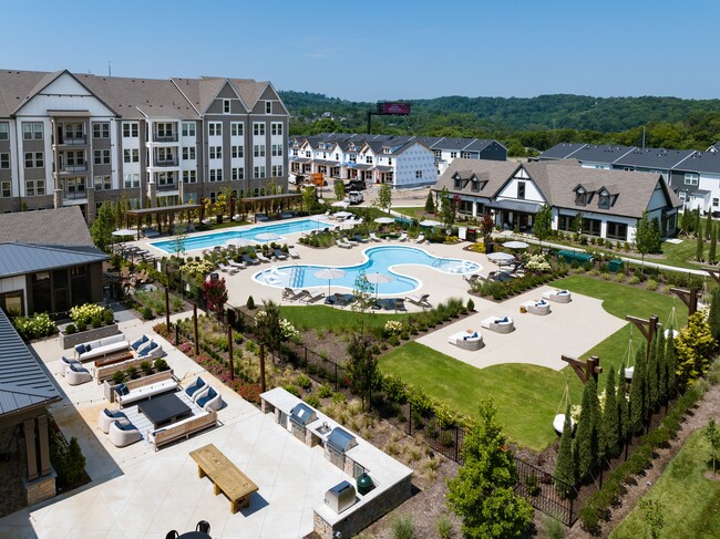 Vibrant Courtyard at Harpeth Heights Featuring Pools, Grilling Stations, and Cabanas - Harpeth Heights Apartments