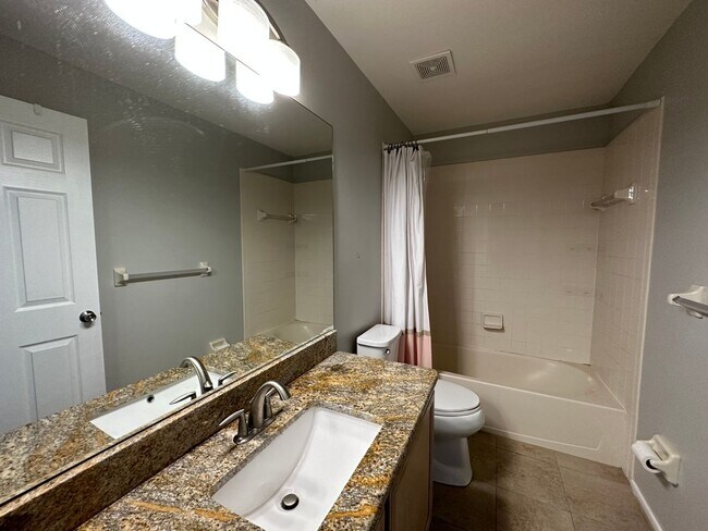 Photo - Beautiful Townhome in a gated community with assigned parking spots and a community pool