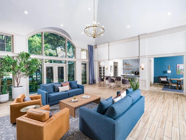 A stylish, sunlit gathering space with seamless access to the club kitchen, dining room, and outdoor views. - Alister Sunset Valley