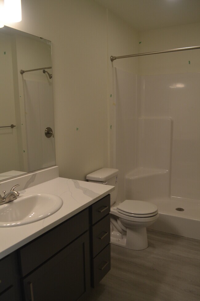 Immaculate bathrooms with walk-in showers - The Dex